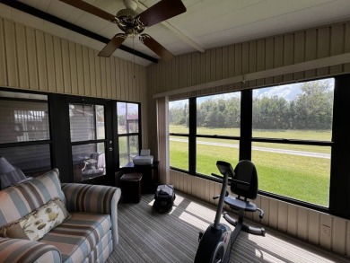 This charming 2-bedroom, 2-bathroom home offers stunning views on Lake Henry Golf Club in Florida - for sale on GolfHomes.com, golf home, golf lot