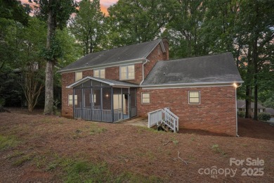Full-brick, two-story home located on the 13th hole of one of on Raintree Country Club in North Carolina - for sale on GolfHomes.com, golf home, golf lot
