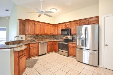 Charming 2-Bedroom, 2-Bath Villa with Garage in the Nantucket on Caloosa Greens Executive Golf Course in Florida - for sale on GolfHomes.com, golf home, golf lot