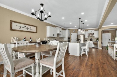 This beautifully maintained home positioned behind the 13th tee on Crow Creek Golf Club in North Carolina - for sale on GolfHomes.com, golf home, golf lot