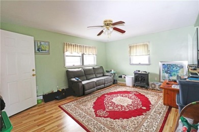 Colonial styled home with 3 beds & 3 baths including a water on Montaup Country Club in Rhode Island - for sale on GolfHomes.com, golf home, golf lot