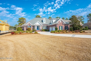 Gorgeous brick home on .54/acre with pond & golf views which is on Ocean Ridge Plantation in North Carolina - for sale on GolfHomes.com, golf home, golf lot