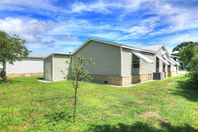 Well-maintained 2-bedroom, 2 bath home in the desirable Barefoot on Barefoot Bay Golf Course in Florida - for sale on GolfHomes.com, golf home, golf lot