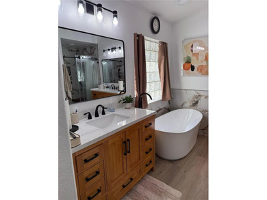 Beautifully maintained and updated 4 bed/2 bath home on a on Wedgefield Golf Club in Florida - for sale on GolfHomes.com, golf home, golf lot