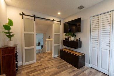 Step into elegance and comfort in this beautifully maintained on Atlantic National Golf and Country Club in Florida - for sale on GolfHomes.com, golf home, golf lot