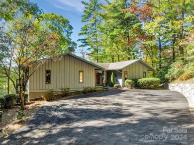 Remarkable golf course and mountain views from this immaculately on Lake Toxaway Country Club in North Carolina - for sale on GolfHomes.com, golf home, golf lot