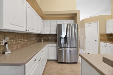 Welcome home to this 4 Bedroom 2 bath Block Stucco Golf Course on Harbor Hills Country Club in Florida - for sale on GolfHomes.com, golf home, golf lot
