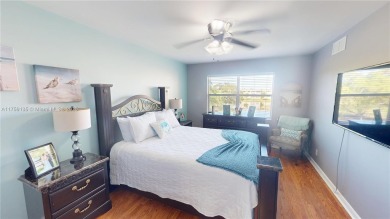 Open the front door to a stunning long lake view!  This is a on Sunrise Lakes Phase III in Florida - for sale on GolfHomes.com, golf home, golf lot