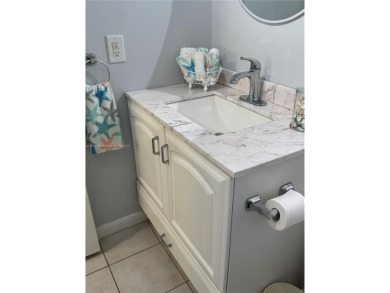Open the front door to a stunning long lake view!  This is a on Sunrise Lakes Phase III in Florida - for sale on GolfHomes.com, golf home, golf lot
