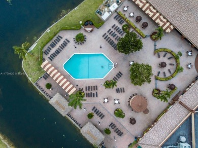 Open the front door to a stunning long lake view!  This is a on Sunrise Lakes Phase III in Florida - for sale on GolfHomes.com, golf home, golf lot