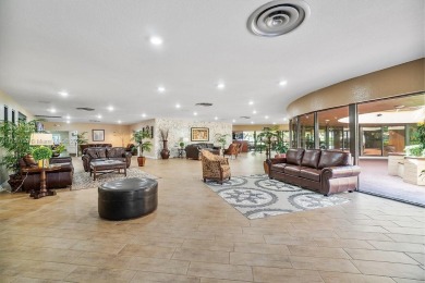 Open the front door to a stunning long lake view!  This is a on Sunrise Lakes Phase III in Florida - for sale on GolfHomes.com, golf home, golf lot