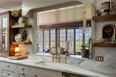 Welcome to this English-inspired brick estate, a must-see in on Glenmoor Country Club in Ohio - for sale on GolfHomes.com, golf home, golf lot