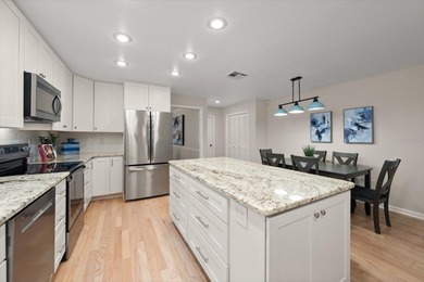 West-facing golf course views and sunset exposure define this on Countryside Country Club in Florida - for sale on GolfHomes.com, golf home, golf lot