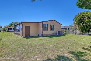 WELCOME TO THIS 2 BEDROOM 2 BATHROOM HOME IN LOVELY BAREFOOT on Barefoot Bay Golf Course in Florida - for sale on GolfHomes.com, golf home, golf lot