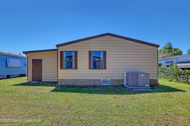 WELCOME TO THIS 2 BEDROOM 2 BATHROOM HOME IN LOVELY BAREFOOT on Barefoot Bay Golf Course in Florida - for sale on GolfHomes.com, golf home, golf lot