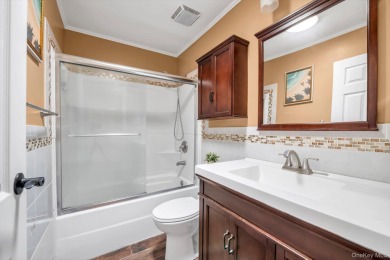 This charming two-bedroom, one-bath Condo exemplifies easy on Holbrook Country Club Golf Course in New York - for sale on GolfHomes.com, golf home, golf lot