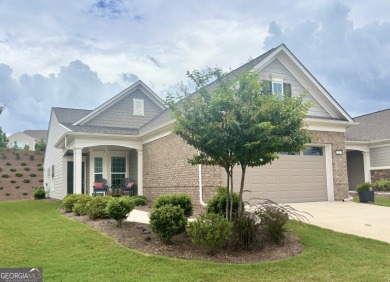 Imagine starting your mornings with coffee on a covered lanai on Canongate Golf At Sun City Peachtree in Georgia - for sale on GolfHomes.com, golf home, golf lot