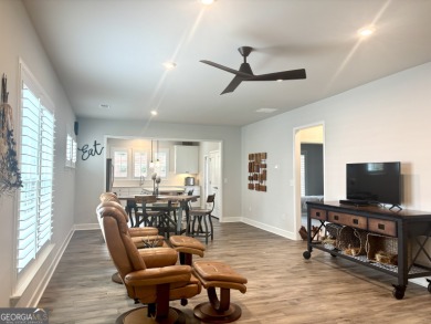 Imagine starting your mornings with coffee on a covered lanai on Canongate Golf At Sun City Peachtree in Georgia - for sale on GolfHomes.com, golf home, golf lot
