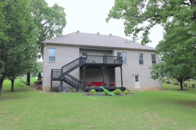 Discover this stunning brick home nestled in a serene golf on Greystone Country Club in Arkansas - for sale on GolfHomes.com, golf home, golf lot