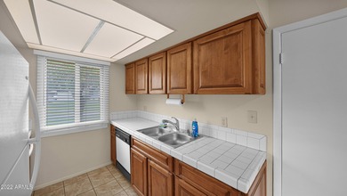 Charming 2 bed 1 bath single level townhome with large east on Scottsdale Silverado Golf Club in Arizona - for sale on GolfHomes.com, golf home, golf lot