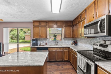 Welcome to this inviting pool home nestled in the desirable and on Blue Cypress Golf Club in Florida - for sale on GolfHomes.com, golf home, golf lot