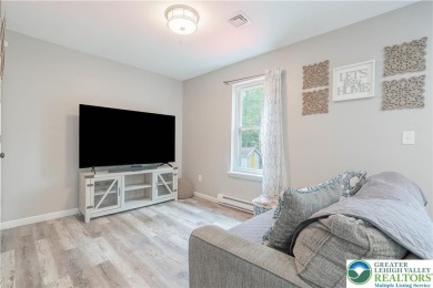 This beautifully renovated 3-bedroom, 3-bathroom home is the on Pocono Farms Country Club in Pennsylvania - for sale on GolfHomes.com, golf home, golf lot