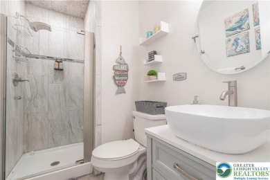 This beautifully renovated 3-bedroom, 3-bathroom home is the on Pocono Farms Country Club in Pennsylvania - for sale on GolfHomes.com, golf home, golf lot