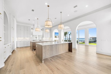 Welcome to 6 Sunset Beach Place, an extraordinary bay front on Golf Club at Bluewater Bay Resort in Florida - for sale on GolfHomes.com, golf home, golf lot