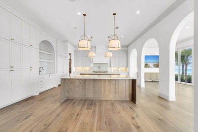 Welcome to 6 Sunset Beach Place, an extraordinary bay front on Golf Club at Bluewater Bay Resort in Florida - for sale on GolfHomes.com, golf home, golf lot