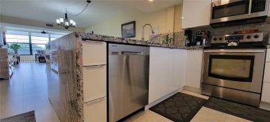 Welcome to this updated spacious condo located on the top floor on Pine Island Ridge Country Club in Florida - for sale on GolfHomes.com, golf home, golf lot