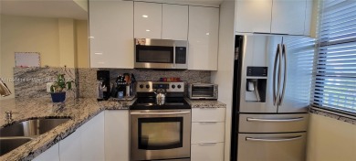 Welcome to this updated spacious condo located on the top floor on Pine Island Ridge Country Club in Florida - for sale on GolfHomes.com, golf home, golf lot