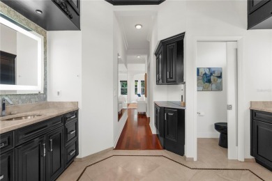 This home is a true SHOWSTOPPER, blending timeless elegance with on Westchase Golf Club in Florida - for sale on GolfHomes.com, golf home, golf lot