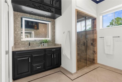 This home is a true SHOWSTOPPER, blending timeless elegance with on Westchase Golf Club in Florida - for sale on GolfHomes.com, golf home, golf lot