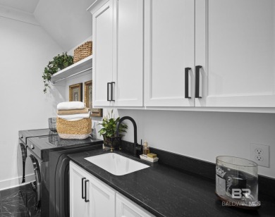 This gold fortified white painted concrete board home in the on Lakewood Golf Club in Alabama - for sale on GolfHomes.com, golf home, golf lot