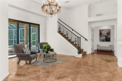 This home is a true SHOWSTOPPER, blending timeless elegance with on Westchase Golf Club in Florida - for sale on GolfHomes.com, golf home, golf lot
