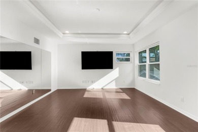This home is a true SHOWSTOPPER, blending timeless elegance with on Westchase Golf Club in Florida - for sale on GolfHomes.com, golf home, golf lot