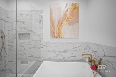 This gold fortified white painted concrete board home in the on Lakewood Golf Club in Alabama - for sale on GolfHomes.com, golf home, golf lot