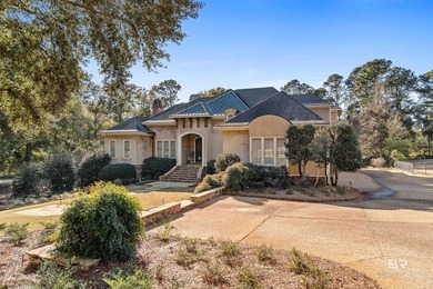 Tucked along the Rock Creek Golf Course in Fairhope, this on Rock Creek Golf Club in Alabama - for sale on GolfHomes.com, golf home, golf lot