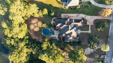 Tucked along the Rock Creek Golf Course in Fairhope, this on Rock Creek Golf Club in Alabama - for sale on GolfHomes.com, golf home, golf lot