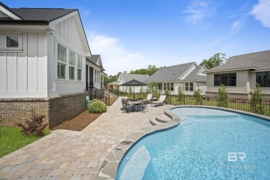 This gold fortified white painted concrete board home in the on Lakewood Golf Club in Alabama - for sale on GolfHomes.com, golf home, golf lot