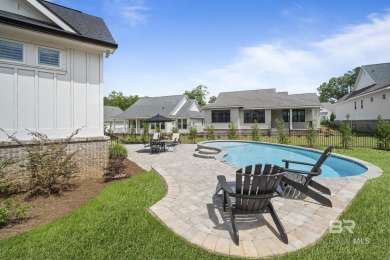 This gold fortified white painted concrete board home in the on Lakewood Golf Club in Alabama - for sale on GolfHomes.com, golf home, golf lot