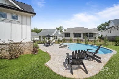 This gold fortified white painted concrete board home in the on Lakewood Golf Club in Alabama - for sale on GolfHomes.com, golf home, golf lot