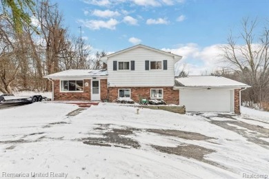 This charming tri-level home is situated on 2.5 acres of on Pine Knob Golf Club - Hawk in Michigan - for sale on GolfHomes.com, golf home, golf lot