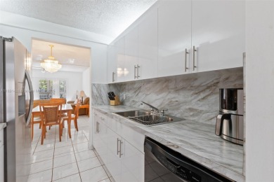 Turn-Key 2/2 Condo in Century Village - where life is anything on Flamingo Lakes Country Club in Florida - for sale on GolfHomes.com, golf home, golf lot