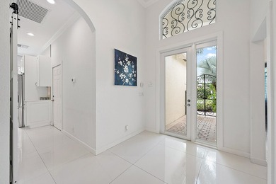 Beautifully renovated and filled with natural light, this bright on Ibis Golf and Country Club in Florida - for sale on GolfHomes.com, golf home, golf lot