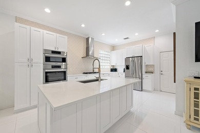 Beautifully renovated and filled with natural light, this bright on Ibis Golf and Country Club in Florida - for sale on GolfHomes.com, golf home, golf lot