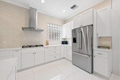 Beautifully renovated and filled with natural light, this bright on Ibis Golf and Country Club in Florida - for sale on GolfHomes.com, golf home, golf lot