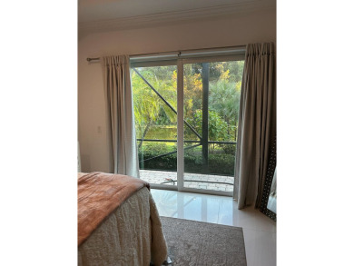 Beautifully renovated and filled with natural light, this bright on Ibis Golf and Country Club in Florida - for sale on GolfHomes.com, golf home, golf lot