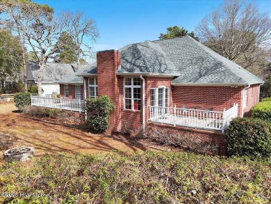 Charming brick home located in the gated community of Lockwood on Lockwood Folly Country Club in North Carolina - for sale on GolfHomes.com, golf home, golf lot