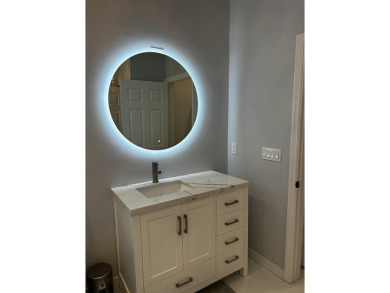 Beautifully renovated and filled with natural light, this bright on Ibis Golf and Country Club in Florida - for sale on GolfHomes.com, golf home, golf lot